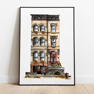 May include: A watercolor painting of a three-story brownstone building with a red door and a stone stoop. The building has a brick facade with white trim and windows. There are fall leaves and pumpkins on the stoop.