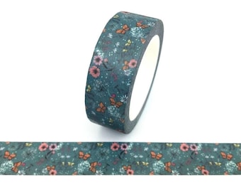 May include: A roll of teal washi tape with a floral and butterfly pattern. The tape features orange, pink, and white flowers, along with orange butterflies, set against a teal background. The tape is unrolled at the bottom, showing the repeating pattern.