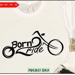 May include: Black and white graphic design of a motorcycle with the text "Born to Ride" on a white t-shirt.
