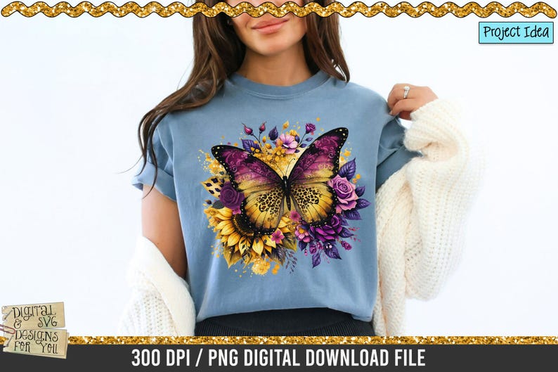 May include: A light blue t-shirt with a colourful butterfly design, featuring purple and yellow wings, and floral elements. The shirt has the text "300 DPI / PNG DIGITAL DOWNLOAD FILE".