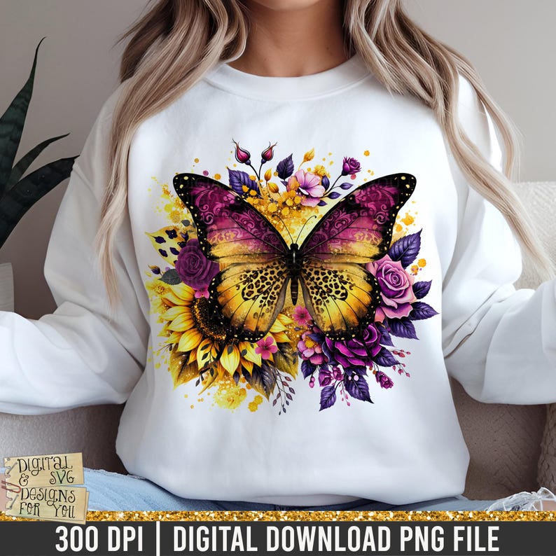 May include: White sweatshirt with a vibrant butterfly design. The butterfly has yellow and purple wings with a leopard print pattern. Sunflowers and purple roses surround the butterfly. The text "DIGITAL & SVG DESIGNS FOR YOU" is visible.
