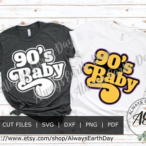 May include: Two t-shirt designs featuring the text "90's Baby" in a retro font. One design is white on a dark grey shirt, and the other is yellow with purple outlines on a white shirt.