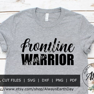 May include: A gray t-shirt with the text "Frontline Warrior" in black lettering. The shirt is on a wooden background. The text "Always Earth Day" and the acronym "AED" are in a circle with green leaves around it.