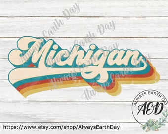 May include: A retro-style graphic featuring the word "Michigan" in a cream-colored, stylized font with a shadow effect. The design incorporates teal, orange, and yellow stripes, with a distressed look. The image includes the text "Always Earth Day" and a shop logo.