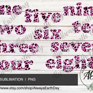 May include: Pink and black leopard print numbers one to ten. The numbers are in a bold, blocky font. The background is a white woodgrain.