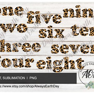 May include: Leopard print numbers one to ten in a bold, blocky font. The numbers are arranged in two rows, with the numbers one, two, three, and four in the top row and five, six, seven, eight, nine, and ten in the bottom row. The background is a light wood grain.
