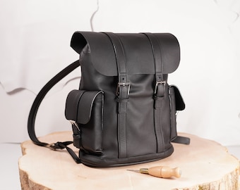 Small leather backpack in alpin style