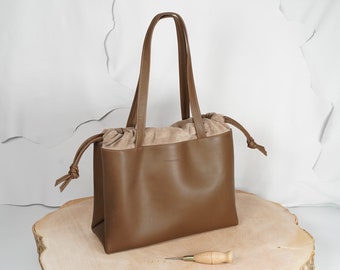 Large handmade leather bag in a pouch shape