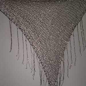 May include: A set of three ceramic mugs with a speckled, matte finish. The mugs are in shades of cream, light gray, and dark gray. Each mug has a simple, minimalist design, perfect for coffee or tea.