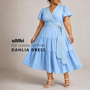 May include: A light blue Dahlia dress with a wrap-style bodice, short sleeves, and a tiered skirt. The dress features a yellow trim and a matching belt. The text "PDF SEWING PATTERN DAHLIA DRESS" is visible.