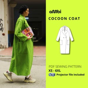 May include: A white ceramic mug with a black handle and the text "But First, Coffee" in a bold, black font. The mug is set against a blurred background, suggesting a cozy setting.