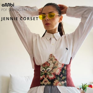May include: A corset with a floral design and burgundy trim is featured in this image. The text "JENNIE CORSET" is displayed. The corset is worn over a white button-down shirt. The image also includes the text "PDF SEWING PATTERN".