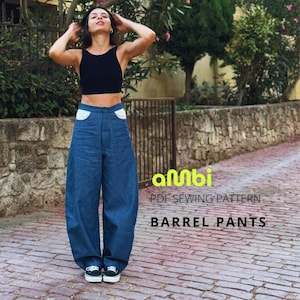 May include: Blue denim barrel pants with white pocket detailing. The high-waisted, wide-legged trousers are paired with a black crop top. The image includes the text "PDF SEWING PATTERN BARREL PANTS".
