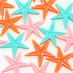 May include: Assortment of colorful starfish in pink, orange, and turquoise. The starfish are made of a shiny, textured material and are perfect for crafting or decorating.