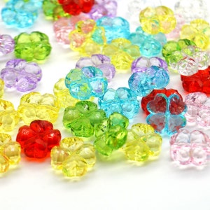 May include: Assortment of colourful plastic flower-shaped beads. The beads are translucent and have a glossy finish. The colours include red, yellow, green, blue, purple, and pink.