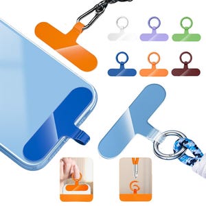 Könnte beinhalten: Ein Handyband mit einem durchsichtigen T-förmigen Halter aus Kunststoff und verschiedenen farbigen Ringen. Das Band wird mit einem blauen Klebestreifen am Handy befestigt. Das Handy ist hellblau und hat ein weißes Apple-Logo. Das Band ist an einem Handy, einem Lanyard und einem Ring befestigt.