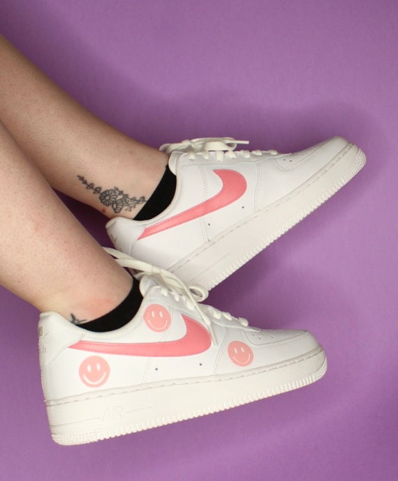 pink air force ones with smiley face