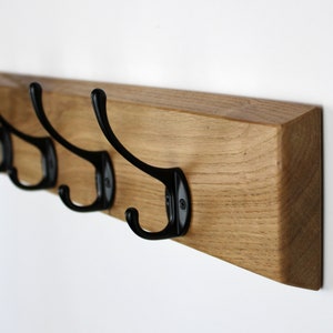 Wall coat rack with black gooseneck hooks image 6