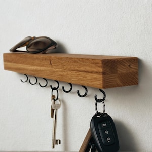 Rustic oak key rack with black screw hooks