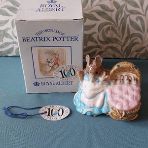 Royal Albert - Beatrix Potter Character- Hunca Munca with her babies- From The Tale of Two Bad Mice by Beatrix Potter-7cms tall