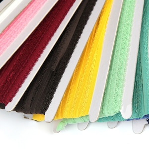 Elastic with a bow for lingerie etc. - Various colors - sold by the meter