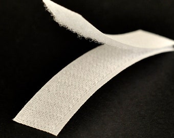 May include: White hook and loop fastener tape, also known as Velcro, with one side featuring soft, fuzzy loops and the other side featuring stiff, hooked fibers.