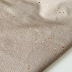 Sweatshirt knit fabric | Splatter with hallows sign on sand | Unique fabric design printed in limited quantity | Sold by half meter