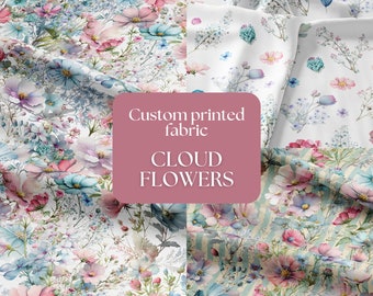 May include: Two fabric swatches with a watercolor floral pattern. The fabric on the left has a white background with pink, blue, and green flowers. The fabric on the right has a white background with blue and pink flowers and a light blue and white striped pattern. The text "Custom printed fabric CLOUD FLOWERS" is in a pink rectangle.