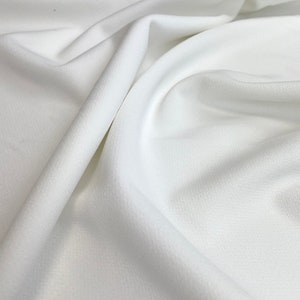 Scuba crepe jersey | Stretchy fabric for fashionable clothing | Body sculpting fabric | Black or white color | Sold by half meter