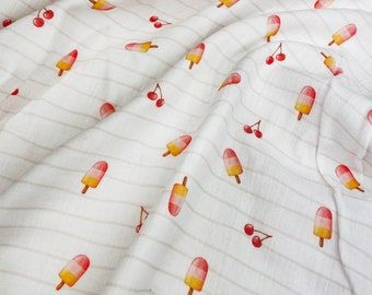May include: White fabric with a repeating pattern of watercolor-style popsicles and cherries. The popsicles have red and yellow sections, and the cherries are red. The fabric has thin, light brown stripes running horizontally.