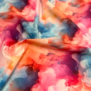 May include: A fabric featuring a vibrant, abstract print of swirling clouds of ink in shades of bright pink, soft orange, and sky blue. The material is draped to create deep folds and shadows, highlighting the fluid, smoke-like patterns.