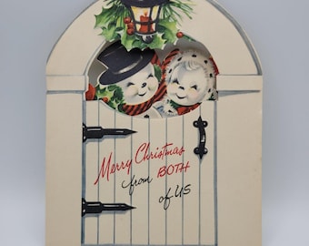 Tarjeta navideña vintage de un muñeco de nieve de artistas famosos de la época navideña.