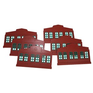 May include: A collection of six red plastic building facade panels featuring a brick texture and green window frames. Each panel displays a rectangular structure with a peaked roof section and multiple window openings arranged in a grid pattern.