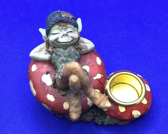 Vintage Pixie on a mushroom taper holder