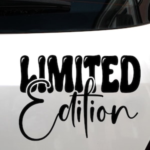 May include: Black "LIMITED Edition" sticker. The word "LIMITED" is in a bold, bubble font, while "Edition" is in a cursive script. The sticker is applied to a white surface, likely a vehicle.