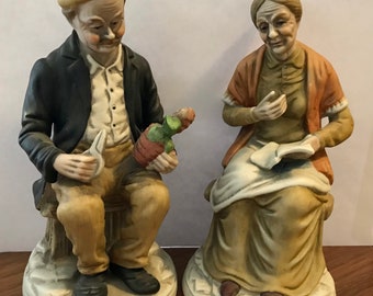 Old couple sitting on benches