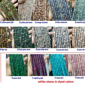 May include: A collection of 14 different types of white stone beads dyed in various colors. The beads are arranged in rows, with each row representing a different color. The colors include red, orange, yellow, green, blue, purple, and pink. The beads are all approximately the same size and shape, and they are all strung on a string.