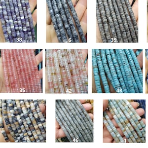 May include: A collection of 12 strands of various gemstone beads. The beads are all cylindrical and have a slightly irregular shape. The colors of the beads include blue, green, brown, gray, pink, and white.