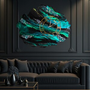 May include: A large, abstract wall clock with a gold-colored frame and Roman numerals. The clock face is set against a backdrop of swirling teal, black, and silver resin. The clock is mounted on a dark wall above a black sofa.