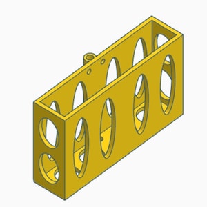 May include: A yellow plastic storage organizer with five oval-shaped compartments. The organizer has a small hole at the top for hanging.