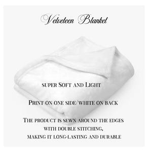 May include: A white velveteen blanket folded in half. The text "SUPER SOFT AND LIGHT" is printed on the blanket. The text "PRINT ON ONE SIDE/WHITE ON BACK" is printed below the first text. The text "THE PRODUCT IS SEWN AROUND THE EDGES WITH DOUBLE STITCHING, MAKING IT LONG-LASTING AND DURABLE" is printed below the second text.