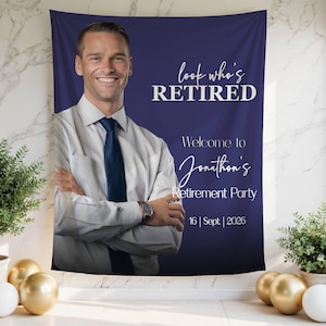 May include: A navy blue retirement party banner featuring a smiling man in a white shirt and blue tie. The banner reads "look who's RETIRED" and "Welcome to Jonathan's Retirement Party 16 | Sept | 2026".