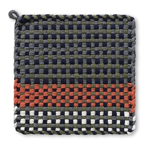 May include: Square woven pot holder with a loop for hanging. The pot holder features a checkerboard pattern in shades of gray, navy, olive green, orange, and white. The woven design provides a textured appearance.
