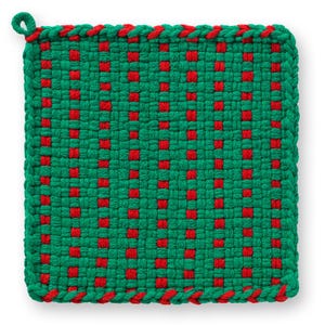 May include: A square, woven potholder in a green and red checkerboard pattern. The edges are finished with a red and green braided trim, and a loop is attached for hanging. The potholder is designed for kitchen use.
