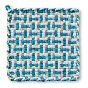 May include: Square woven potholder in a geometric pattern. The potholder features a repeating pattern of teal, white, and yellow squares. The edges are finished with a white and teal braided trim and a hanging loop.