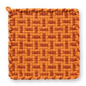 May include: Square, woven potholder in shades of orange and rust. The potholder features a geometric pattern and a loop for hanging. The edges are finished with a braided trim. A kitchen textile.