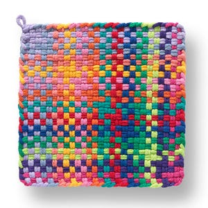 May include: A square, woven hot pad in a vibrant array of colors. The design features a patchwork of red, orange, yellow, green, blue, and purple threads, creating a textured, multi-colored pattern. A small loop is attached for hanging.