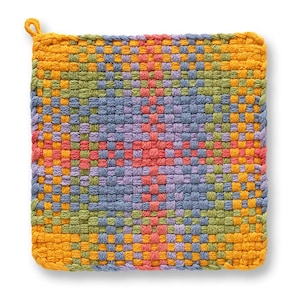 May include: A square, woven hot pad in a vibrant color palette. The design features a central pattern of red, purple, and blue, surrounded by green, orange, and yellow. A small loop is attached to one corner for hanging.