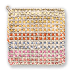 May include: A square, woven pot holder with a loop for hanging. The design features a gradient of colors, including yellow, orange, blue, and pink, set against a neutral background. The edges are neatly finished with a matching thread.