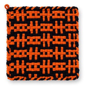 May include: Square, woven pot holder in black and orange. The pot holder features a repeating geometric pattern. A loop is attached to one corner for hanging. The pot holder is approximately 8 inches square.